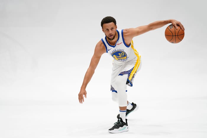 Golden State Warriors guard Stephen Curry dribbles the ball during Media Day.